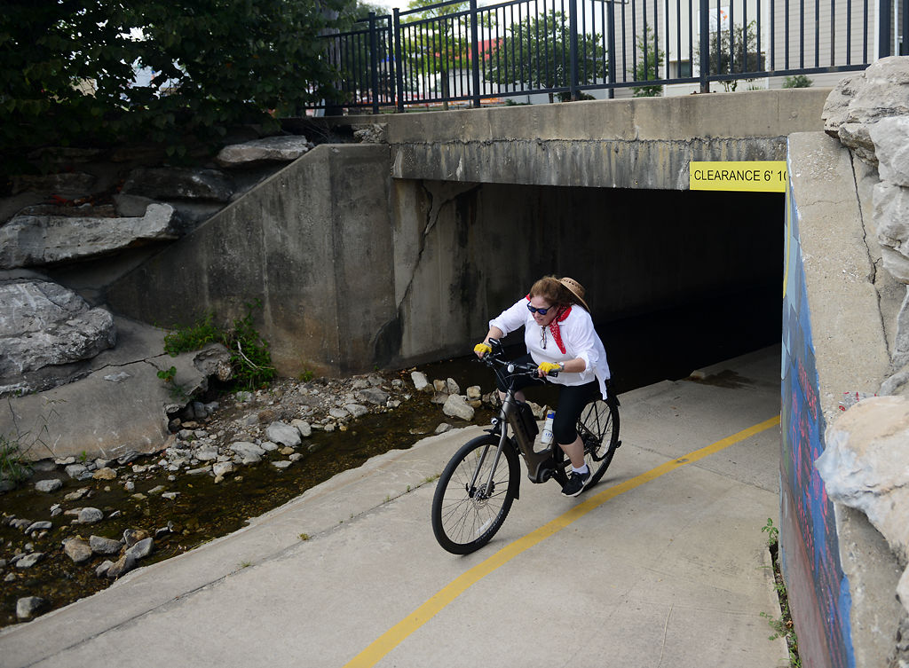 Anne Orazio pushes up a small hill near the start of the MKT trail at Flat Branch Park